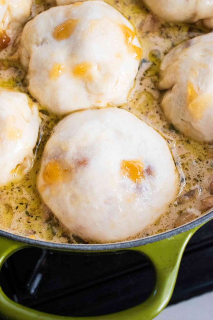 Scoops of dumplings on top of the creamy chicken stew 