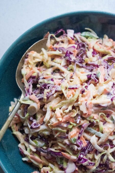 The Big Tasty Bites Coleslaw in a bowl with purple and green cabbage