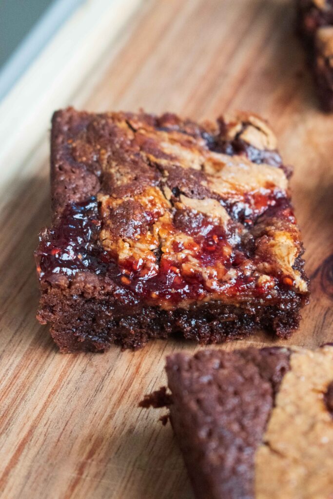 One Peanut Butter and Jam Brownie on a plate delicious